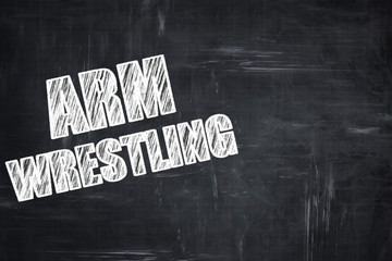 Chalkboard writing: arm wrestling sign background