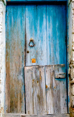 old wooden door with rusty knocker