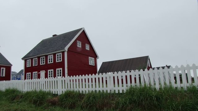 Traditional timber house and picket fence in Nuuk, Greenland