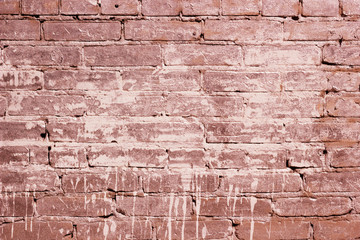 Red brick wall texture with a paint spot. The background of the brickwork