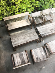 Top view of wooden picnic tables and chairs