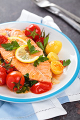 Fried salmon  with vegetables.
