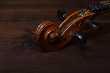 Fototapeta premium violin in vintage style on wood background