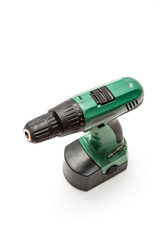 green electric screwdriver isolated on white