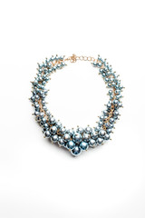 necklace of beads and gold chains isolated