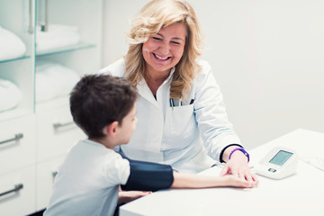 Obraz premium Pediatrics. Measuring blood pressure