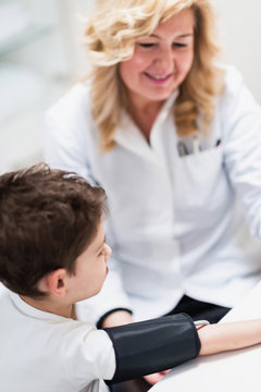 Little boy at pediatrician, measuring blood pressure