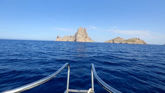 Boating sailing in Ibiza near es Vedra island on Mediterranean sea of Balearic islands of spain