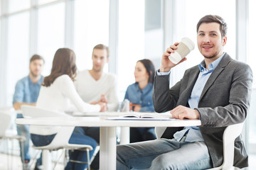 Obraz premium Positive man drinking coffee.