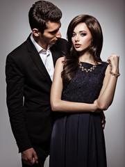 Studio portrait of young beautiful flirting  couple in love