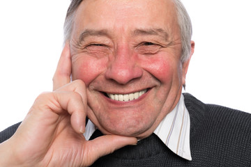 Close up portrait of an elegant senior man isolated on white bac