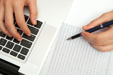 Business woman hand typing on laptop keyboard