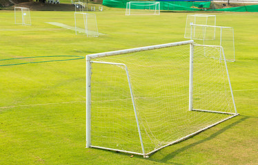 Fototapeta premium A view of a net on a vacant soccer pitch.