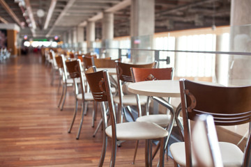 Fototapeta na wymiar Tables in cafe Airport with beutifull bokeh