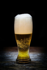 Beer mug on old wood background.