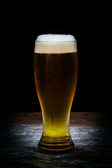 Beer mug on old wood background.