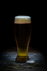 Beer mug on old wood background.