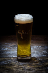 Beer mug on old wood background.