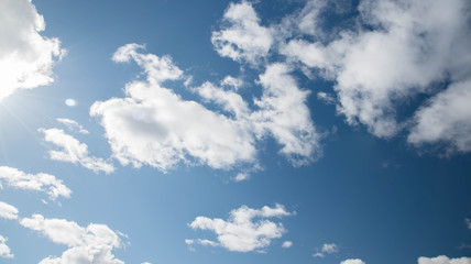 white fluffy clouds in blue sky