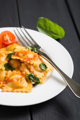 Ravioli with tomato sauce and basil