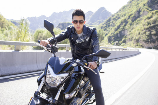 Young man riding motorcycle