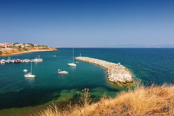 Fototapeta na wymiar Sunny view of Mediterranean sea from Nea Fokia, Greece.