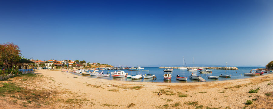 Boats in Bay of Nea Fokia village, Halkidiki, Greece.