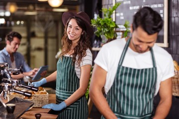 Smiling barista looking at the camera