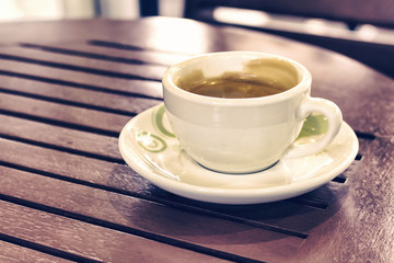 close-up, Cup of Coffee on table in coffee shop [blur and select focus background]