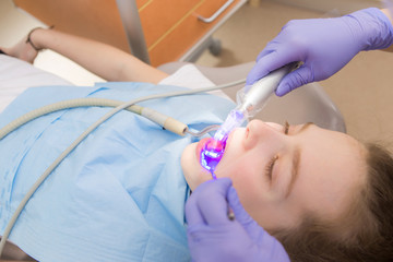 Young girl at dentist., dental treatment 
