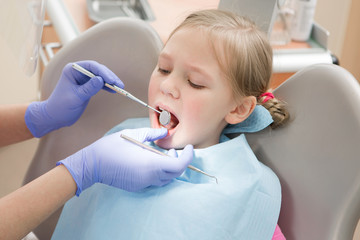 Fototapeta premium Young girl at dentist., dental treatment 