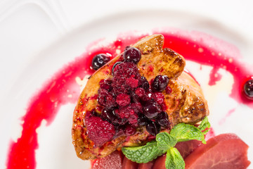 Grilled foie gras with sliced pear.