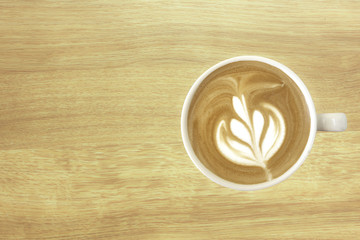 Latte coffe with wooden texture for background