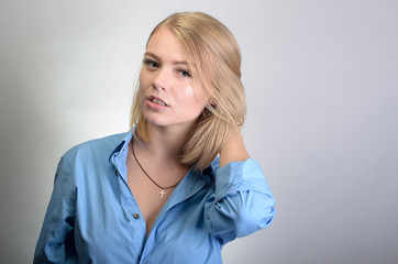 Portrait of a young woman on a gray background