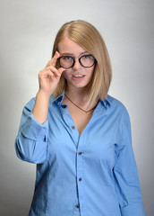 young attractive woman in round glasses