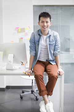 Portrait of young man in office