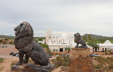  Bronze Lion and Mission San Xavier del Bac, which  is a historic Spanish Catholic mission located about 10 miles south of downtown Tucson, Arizona,