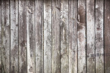 Gray grunge wooden desks background.