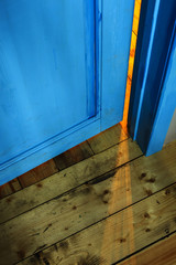 slit in the slightly opened door 