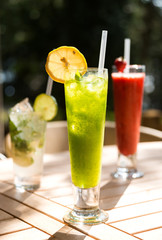 Colorful cocktail with lemon, mint and ice, selective focus
