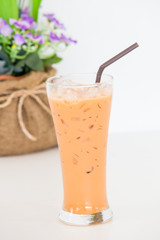 Iced Thai tea with milk in glass