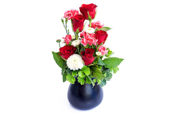 Vase of roses on white background.