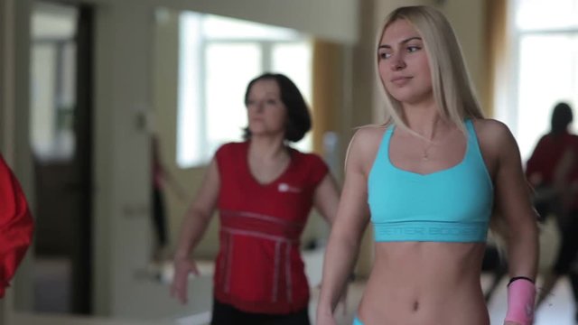 Attractive girl in the group aerobics classes
