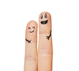 close up of two fingers with smiley faces