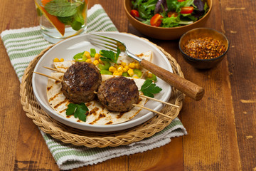 Cutlets or Sausage Patties Skewers for Dinner. Selective focus.