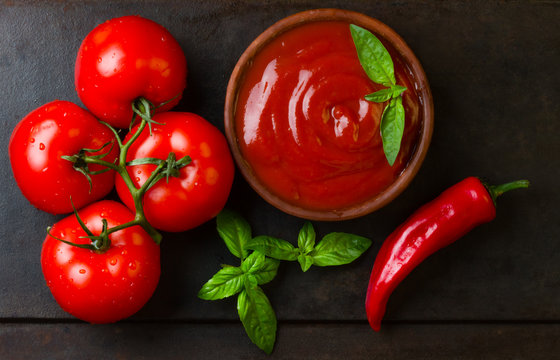 Tomato sauce salsa and ingredients - tomatoes, chili, garlic