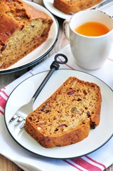 Vegan banana cake with raisins, dried cranberries and nuts.