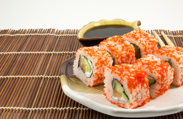 Japanese seafood sushi rolls with  soy sauce background