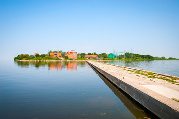 Fototapeta premium Concrete footbridge to island