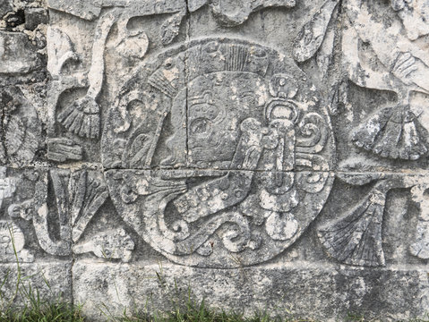 skulls sculpture detail in chichen itza mexico